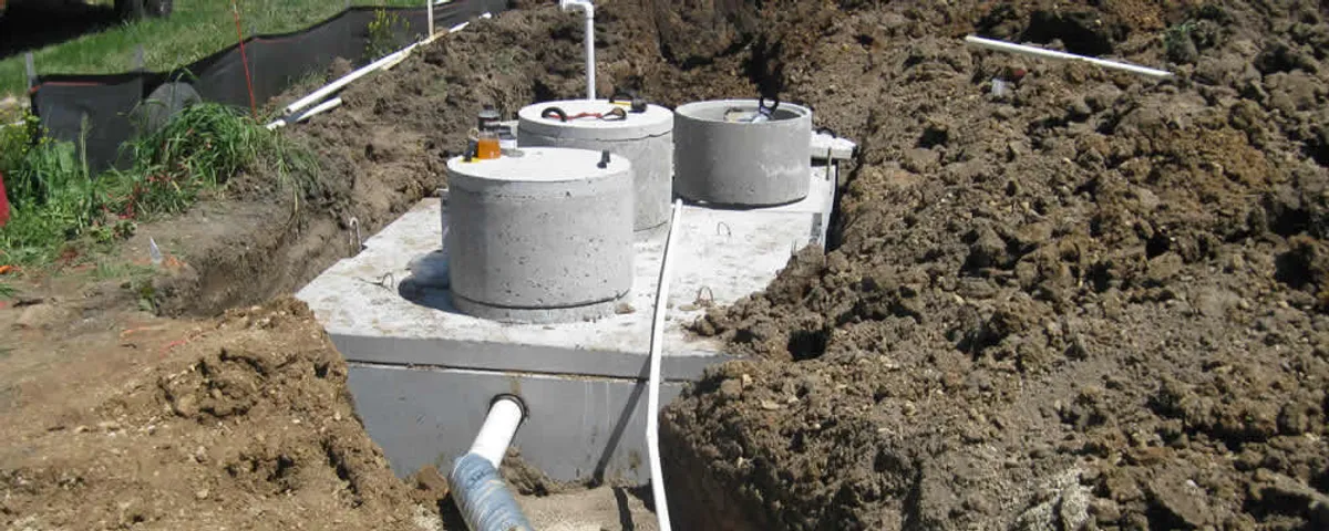 Septic system repair and installation site with tank access ports in Austin, TX