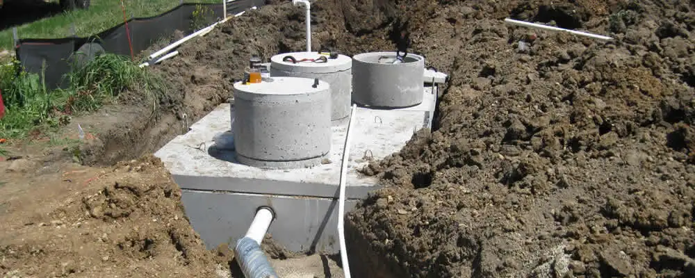Septic system repair and installation site with tank access ports in Austin, TX