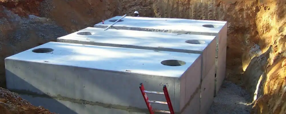 Septic tank installation site with a newly placed concrete tank in Austin, TX